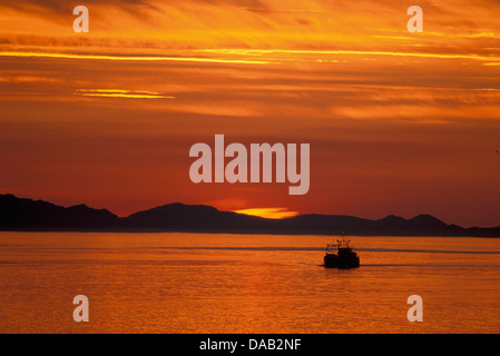 Sunset, Passage, near Petersburg, Alaska, USA, outlined, orange, sunrise, twilight, dusk, dawn, evening, night, boat, lake Stock Photo