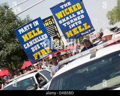 June 29, ALBUQUERQUE, NEW MEXICO, USA. Anti-Gay religious protesters carrying signs clash with gay pride parade festival goers Stock Photo