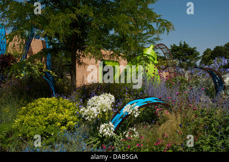 Hampton Court, UK. 8th July 2013. The Ecover Garden at RHS Hampton Court Palace Flower Show 2013 on Press Day, Monday 8th July 2013 in London, UK. The Gold medal winning garden designed by Matthew Childs and sponsored by Ecover also won the Best in Show Award.The conceptual garden highlights pollution and plastic in aquatic environments. Credit:  Miriam Heppell/Alamy Live News Stock Photo