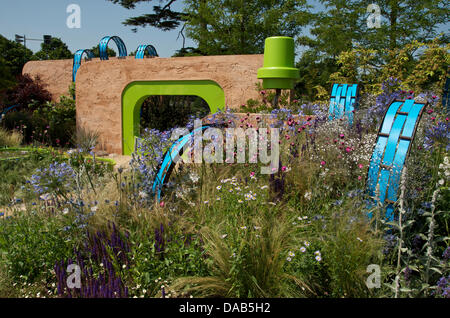 Hampton Court, UK. 8th July 2013. The Ecover Garden at RHS Hampton Court Palace Flower Show 2013 on Press Day, Monday 8th July 2013 in London, UK. The Gold medal winning garden designed by Matthew Childs and sponsored by Ecover also won the Best in Show Award. the garden highlights the plastic and pollution found in our aquatic environments. Credit:  Miriam Heppell/Alamy Live News Stock Photo