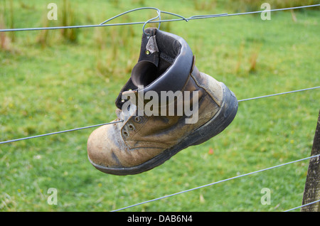 Walking boot attached to a fence in Raglan Coast, New Zealand. Stock Photo