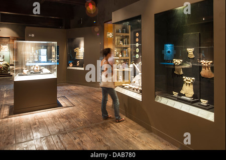 Viewing Pre-Columbian artifacts archaeological art artwork display in the Larco Museum, Lima, Peru. Stock Photo