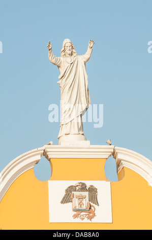 Christ statue on the 17th century steeple and bell tower of the Cathedral of Trujillo catholic church, Trujillo, Peru. Stock Photo