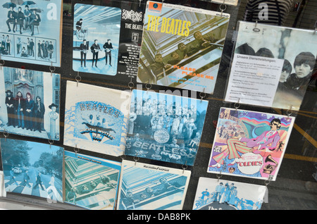 Old faded Beatles records in a shop window Stock Photo