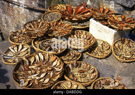 Baskets of salted and dried fishes at Furongzhen village also known as Hibiscus Town or Furong Village in Hunan province China Stock Photo