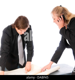 Woman manager shows a location on a topo map to a young colleague Stock Photo