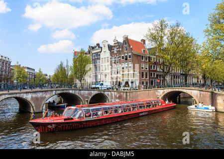 Tourist boat crossing Keizersgracht Canal, Amsterdam, Netherlands, Europe Stock Photo