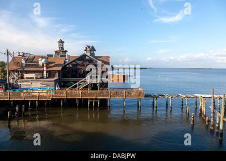 Seabreeze waterfront restaurant and wooden dock, a portion of which is wrecked and abandoned, located in Cedar Key, Florida. Stock Photo