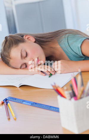 Little girl sleeping on books Stock Photo