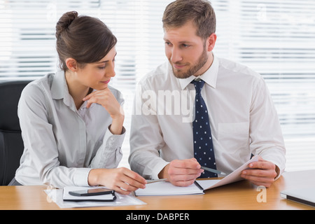 Business people working on documents Stock Photo