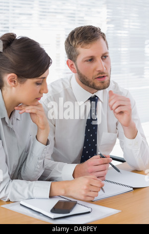 Business people discussing documents Stock Photo