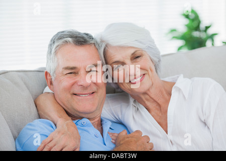 Couple relaxing on the couch Stock Photo