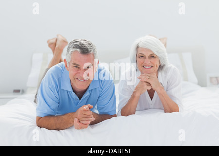 Couple lying together in bed Stock Photo