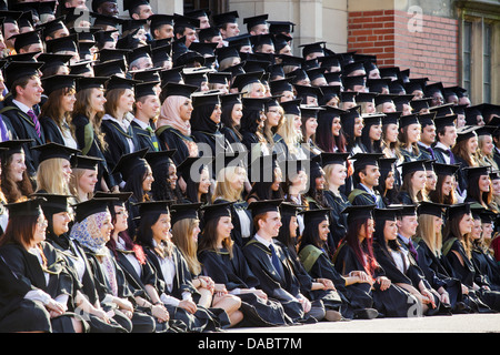 Graduates from Birmingham University, UK, pose for their graduation photograph on the steps of the Great Hall. Stock Photo