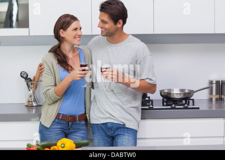 Couple clinking their glasses of red wine Stock Photo