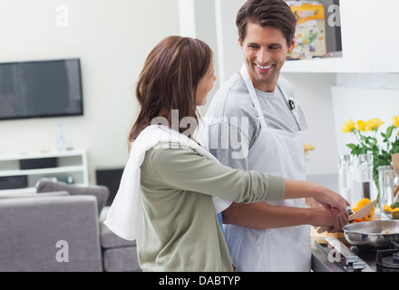 Man and woman cooking together Stock Photo