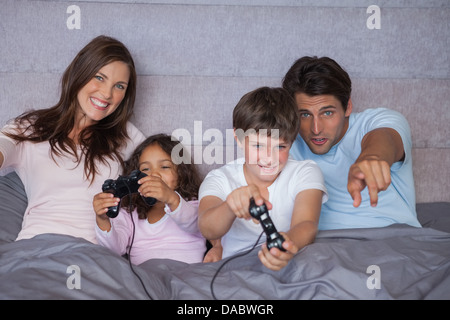 Happy family playing video games Stock Photo