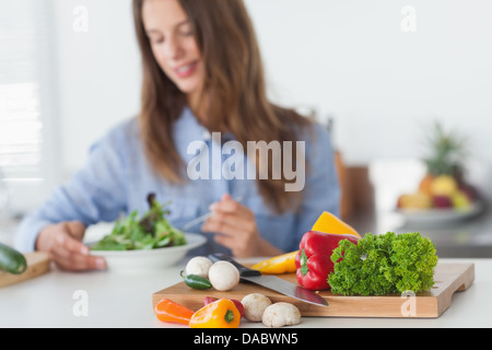 Pretty woman eating a vegetarian salad Stock Photo