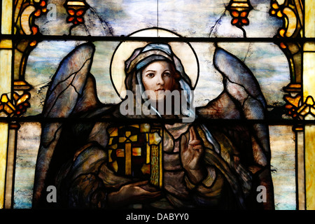 Stained glass window by Louis Comfort Tiffany showing an angel holding the Bible, The American church in Paris, France Stock Photo