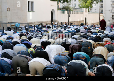 Muslims praying outside the Paris Great Mosque on Eid al-Fitr festival, Paris, France, Europe Stock Photo