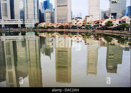 Boat quay in Singapore with reflection in a river Stock Photo