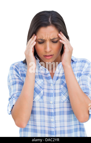 Woman with a headache rubbing her temples Stock Photo