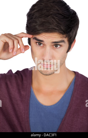 Young man with hand on forehead Stock Photo