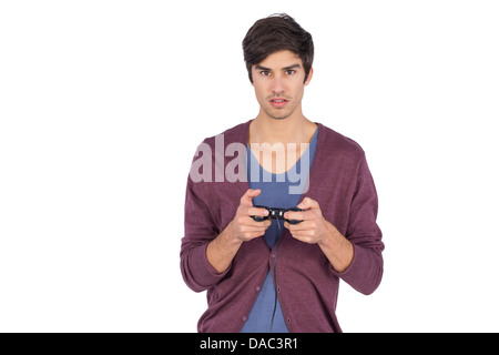 Young man concentrated on video games Stock Photo