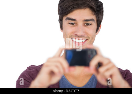 Young man using digital camera Stock Photo