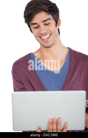 Laughing man using a laptop Stock Photo
