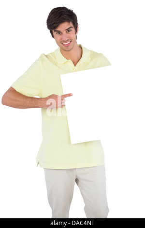 Happy man pointing something on empty sign Stock Photo