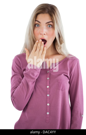 Surprised woman with hand on mouth Stock Photo