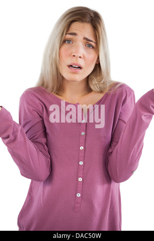 Confused young woman looking at camera Stock Photo