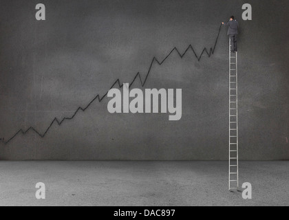 Businessman standing on a giant ladder and writing a black chart Stock Photo