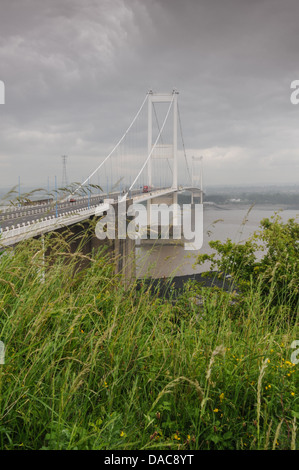 Rain clouds gather over the old Severn Bridge taking the M48 over the river into Wales Stock Photo