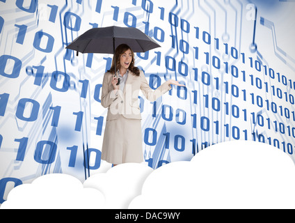 Businesswoman in front of printed circuit Stock Photo