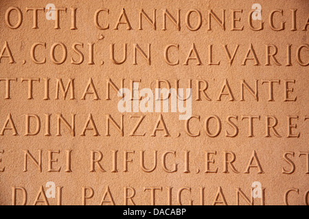 Italian characters on a stone tablet in San Gimignano in Tuscany Stock Photo
