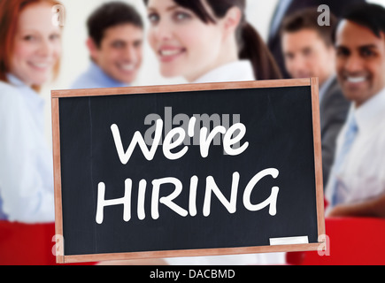 We're hiring written on chalkboard Stock Photo