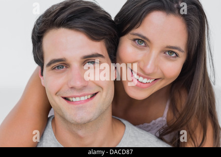 Portrait of a woman embracing her partner Stock Photo