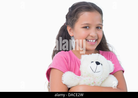Little girl holding her teddy bear