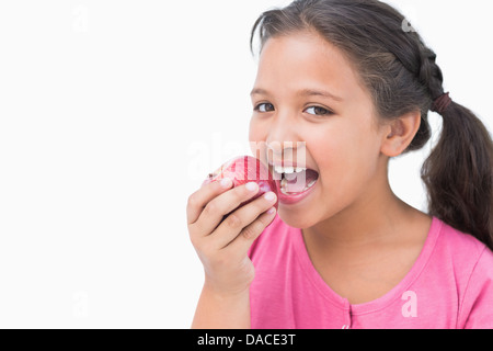 Little girl eating apple Stock Photo