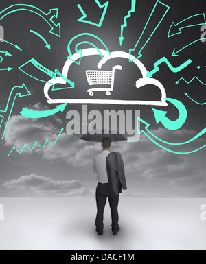 Businessman looking at a drawing of a cloud with shopping cart Stock Photo