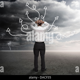 Frustrated businessman looking at a drawing Stock Photo