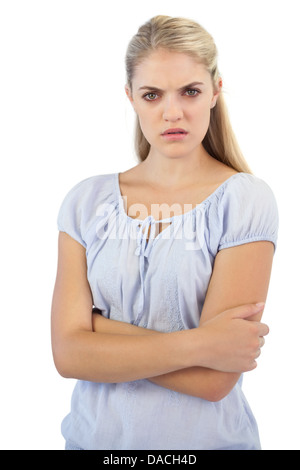 Outraged blonde woman with arms crossed Stock Photo
