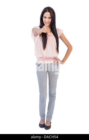 Young woman pointing her finger at camera Stock Photo