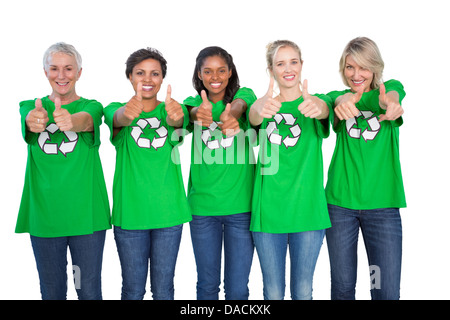 Team of female environmental activists giving thumbs up Stock Photo