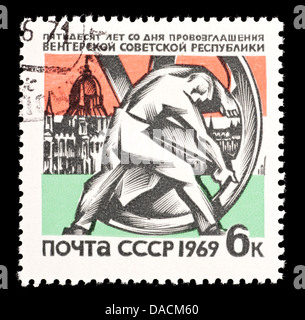 Soviet Union postage stamp depicting the sculpture 'Shoulder to the Wheel' by Zigmond Kisfaludi-Strobl, Budapest & Parliament. Stock Photo