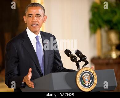 Washington DC, USA. 10th July, 2013. US President Barack Obama addresses the audience before presenting the 2012 National Medals of Arts and Humanities during a ceremony in the East Room of the White House in Washington, DC. USA, on 10 July 2013. Photo: Ron Sachs/CNP/dpa/Alamy Live News Stock Photo