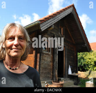 Anne Donath is pictured in front of her hut in Steinhausen, Germany, 14 September 2011. For 18 years now, she has been living on 16 square meters without water or electricity. Photo: Stefan Puchner Stock Photo