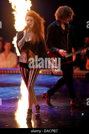 The lead singer of the band 'Jennifer Rostock', Jennifer Weist, representing the German state of Mecklenburg-Western Pomerania, performs with her band on stage during the 'Bundesvision Song Contest 2011' in Cologne, Germany, 29 September 2011. Musicians and bands representing the 16 German states competed against each other in this year's edition of the Bundesvision Song Contest 20 Stock Photo